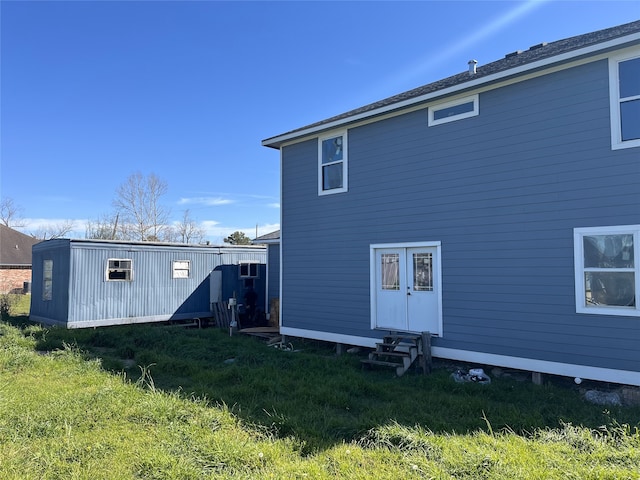 rear view of property with entry steps