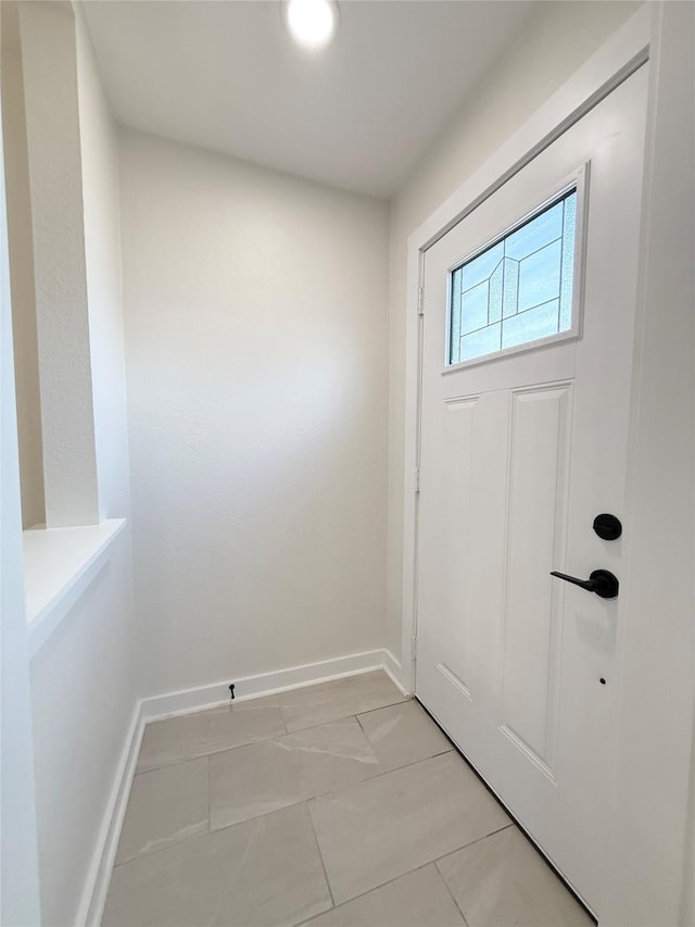 doorway with baseboards