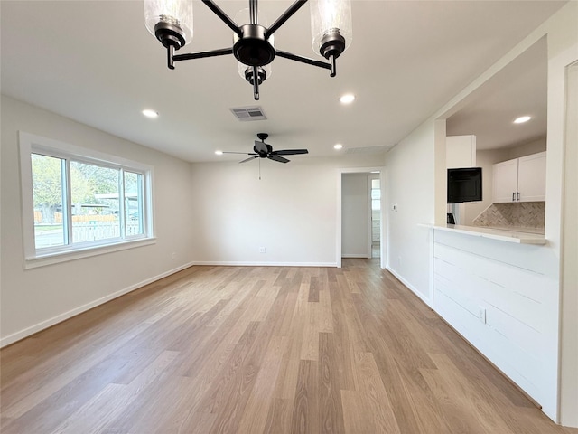 unfurnished living room with recessed lighting, visible vents, light wood-style floors, ceiling fan, and baseboards