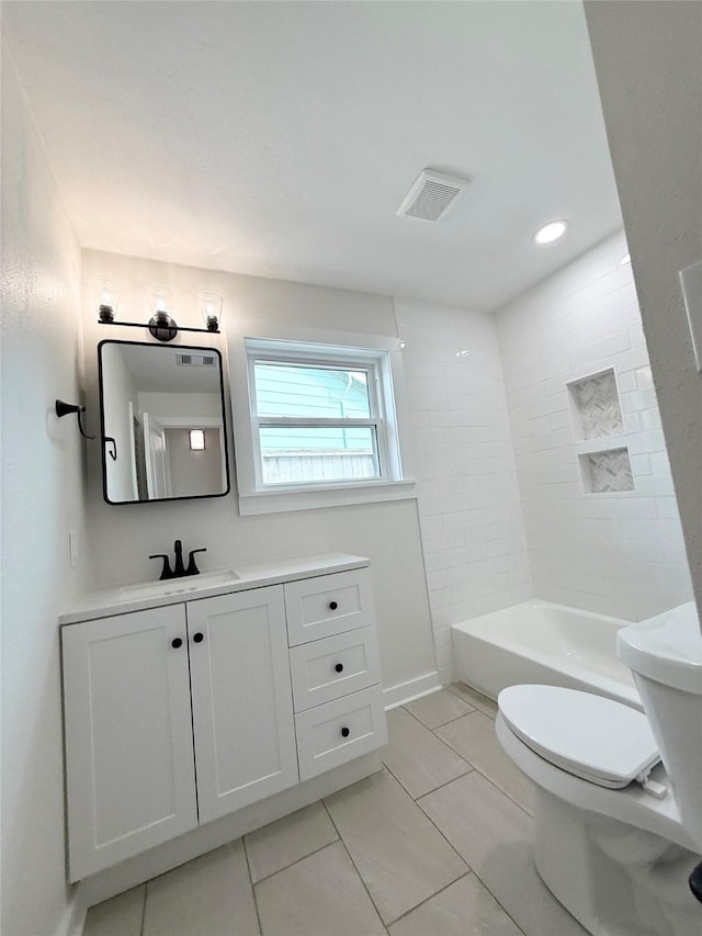 full bath featuring visible vents, shower / bathtub combination, vanity, and toilet