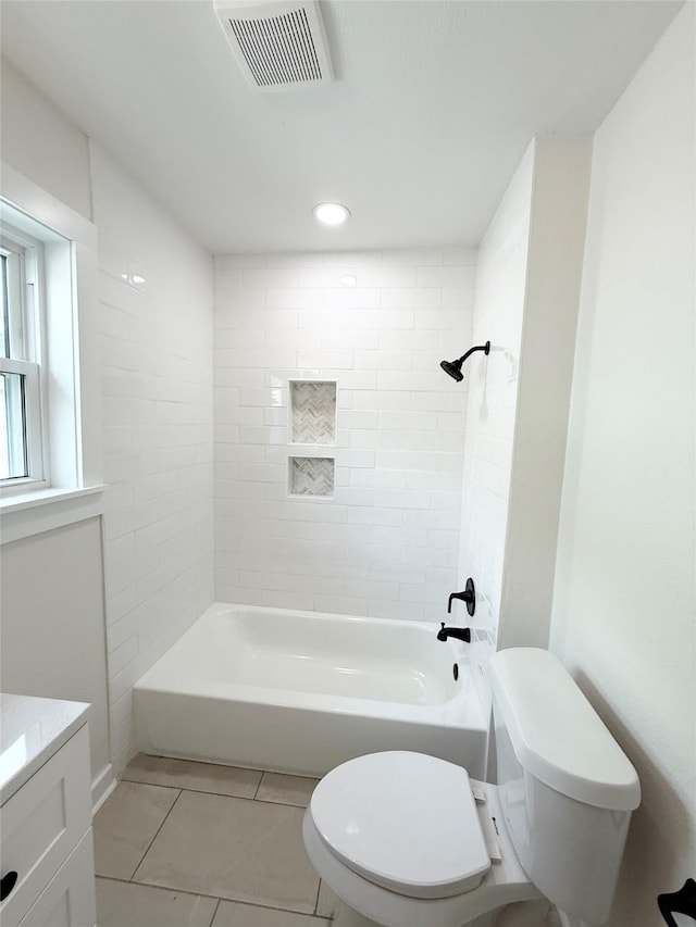 full bathroom featuring visible vents, toilet, shower / tub combination, tile patterned flooring, and vanity