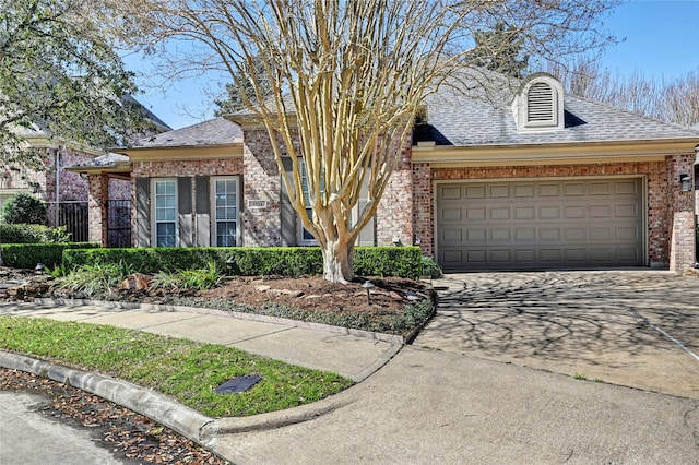 view of front of home featuring brick siding, driveway, and an attached garage