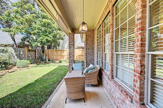 view of patio / terrace featuring fence