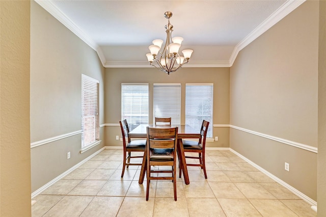 dining room with a chandelier, light tile patterned flooring, baseboards, and crown molding