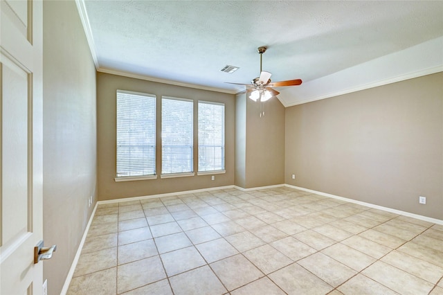 empty room with baseboards, visible vents, ceiling fan, ornamental molding, and a textured ceiling