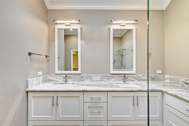 full bathroom with double vanity, ornamental molding, a sink, and tiled shower