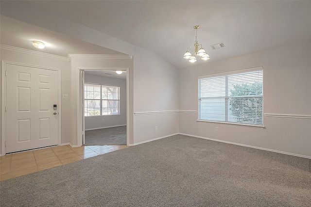 interior space with crown molding, visible vents, an inviting chandelier, carpet flooring, and vaulted ceiling