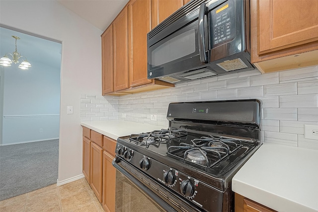 kitchen with light tile patterned floors, decorative backsplash, light colored carpet, light countertops, and black appliances