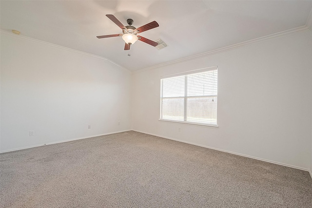 carpeted spare room with ornamental molding, lofted ceiling, visible vents, and ceiling fan