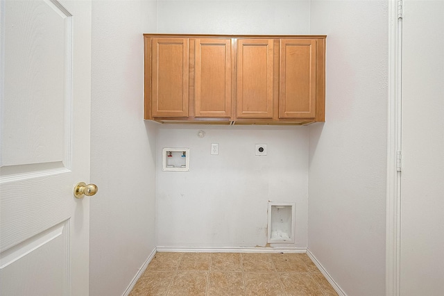 laundry room with washer hookup, cabinet space, hookup for an electric dryer, gas dryer hookup, and baseboards