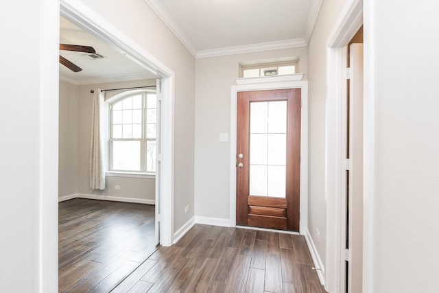 entrance foyer with dark wood finished floors, baseboards, and ornamental molding