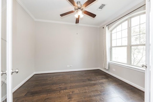 unfurnished room with visible vents, baseboards, ornamental molding, and dark wood finished floors