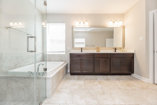 full bath featuring a bath, a sink, an enclosed shower, and double vanity