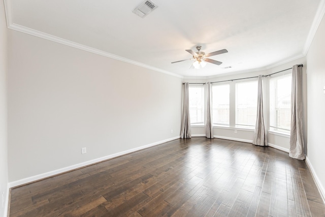 unfurnished room featuring baseboards, a ceiling fan, dark wood-style floors, and crown molding