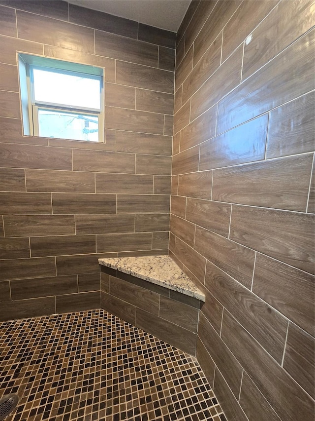 full bathroom featuring tiled shower