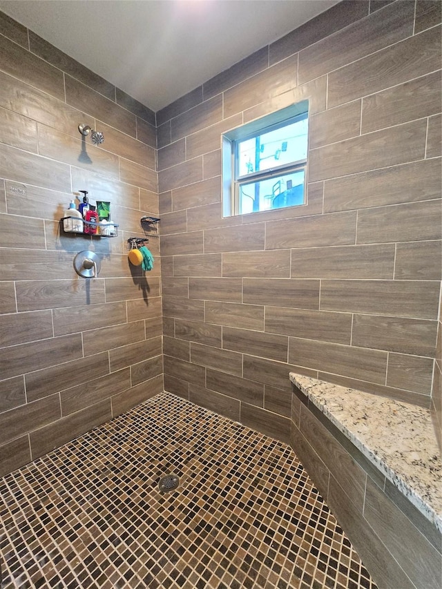 bathroom featuring tiled shower