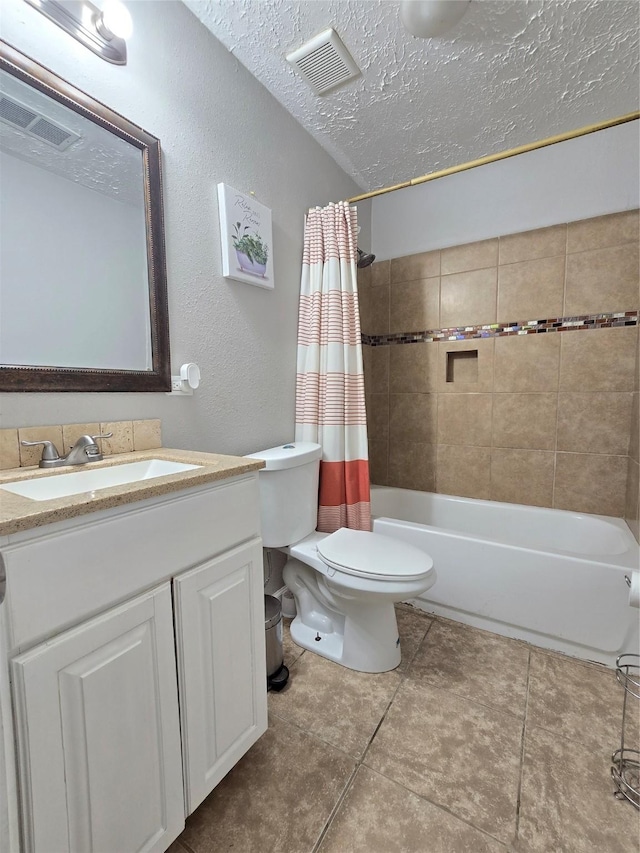 full bathroom featuring shower / bath combo, visible vents, a textured ceiling, and toilet