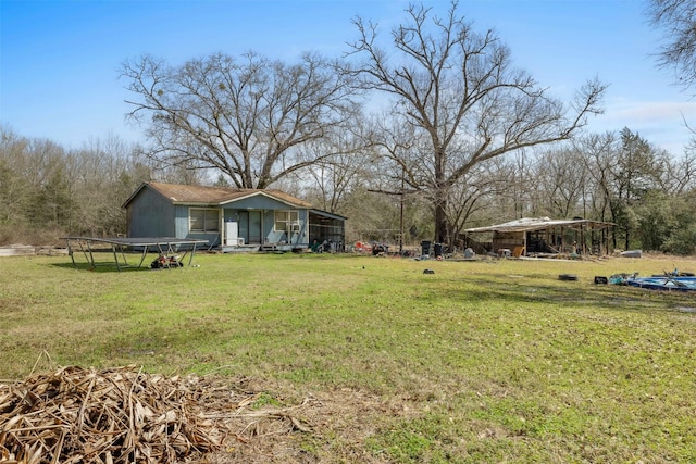 view of yard with a trampoline