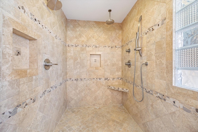 bathroom featuring a tile shower