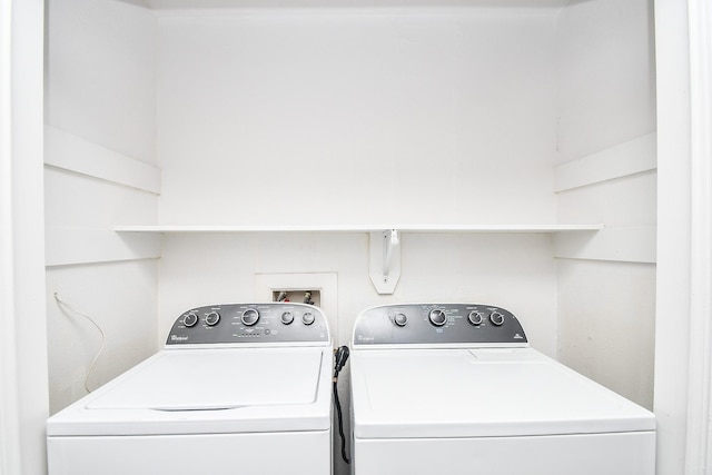 clothes washing area with laundry area and washer and clothes dryer