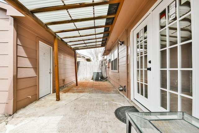 view of patio featuring fence and central AC unit