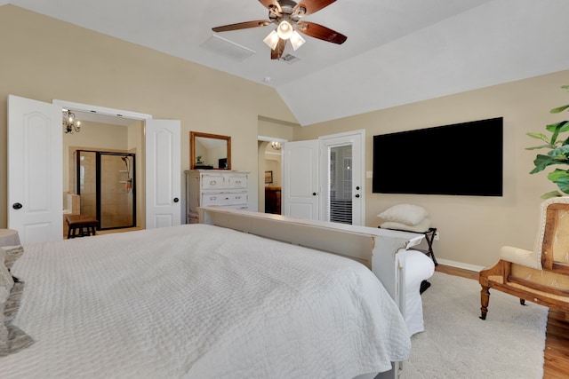 bedroom with visible vents, vaulted ceiling, baseboards, and wood finished floors