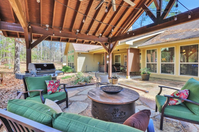 view of patio with an outdoor hangout area and grilling area