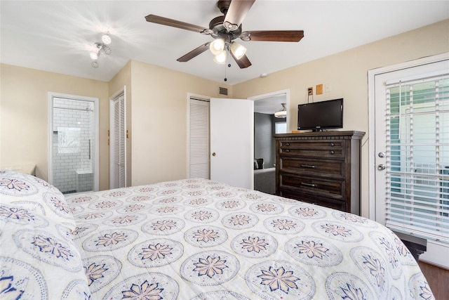 bedroom featuring ensuite bathroom, visible vents, and a ceiling fan