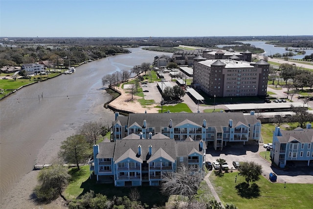 birds eye view of property featuring a water view and a residential view