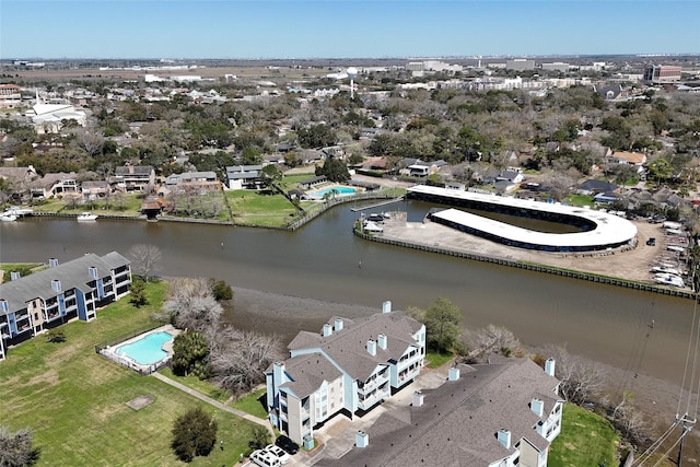 bird's eye view featuring a water view and a residential view