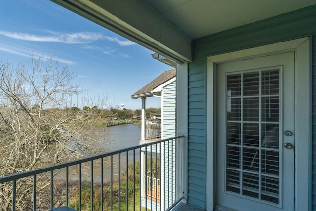 balcony featuring a water view