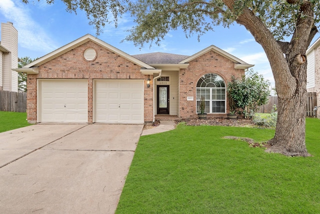 ranch-style home featuring a front yard, fence, and brick siding