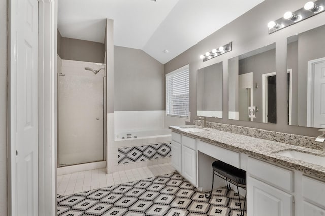 full bathroom with a stall shower, tile patterned flooring, and a sink