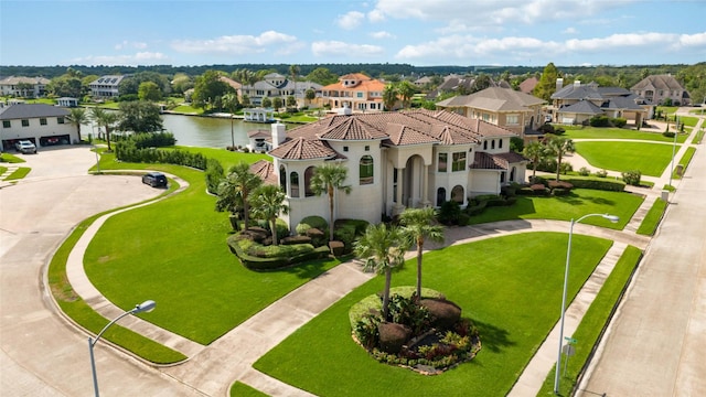 aerial view with a water view and a residential view