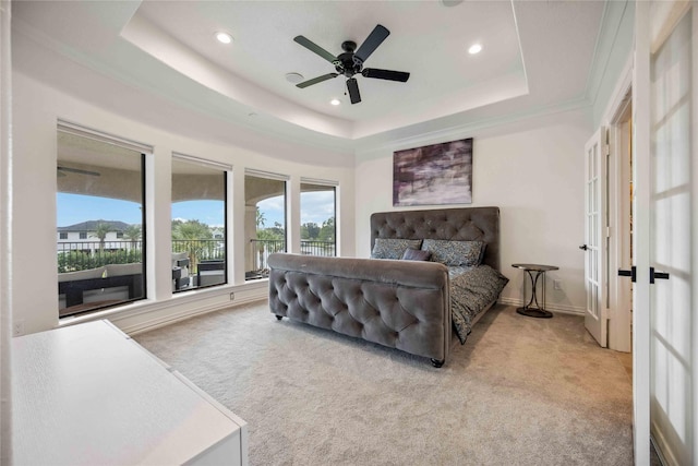 carpeted bedroom featuring ceiling fan, french doors, a raised ceiling, baseboards, and recessed lighting