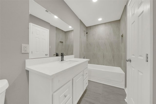 bathroom with shower / bathtub combination, toilet, visible vents, vanity, and marble finish floor