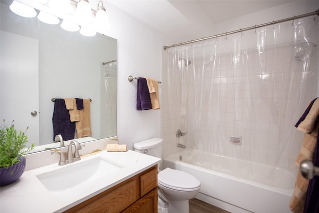 bathroom featuring vanity, toilet, and shower / tub combo with curtain