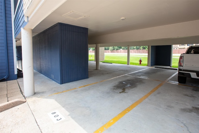 garage with fence