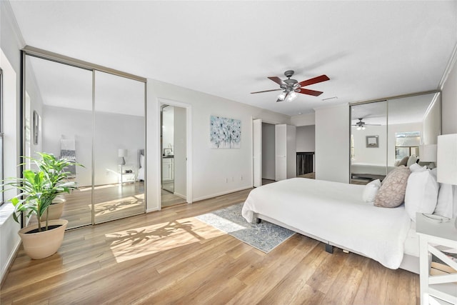 bedroom with baseboards and wood finished floors