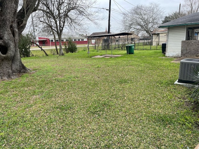 view of yard with fence and cooling unit