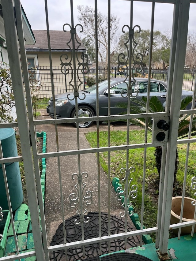 view of gate featuring fence