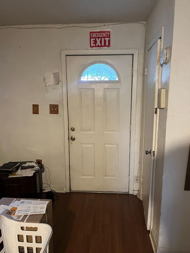 doorway to outside featuring dark wood-style flooring