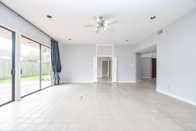 empty room with a ceiling fan, visible vents, baseboards, and light tile patterned floors