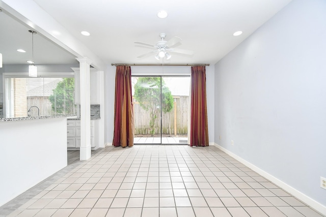 spare room with decorative columns, baseboards, a ceiling fan, light tile patterned flooring, and recessed lighting