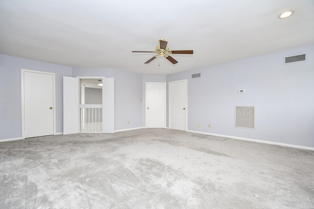 interior space featuring baseboards, visible vents, and carpet flooring