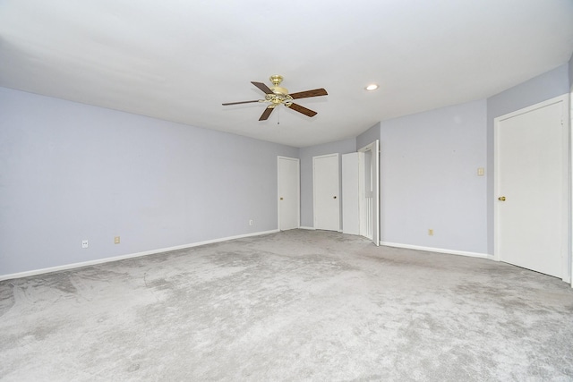 interior space with carpet floors, ceiling fan, baseboards, and recessed lighting