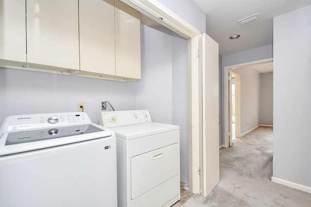 washroom with cabinet space, visible vents, light carpet, independent washer and dryer, and baseboards