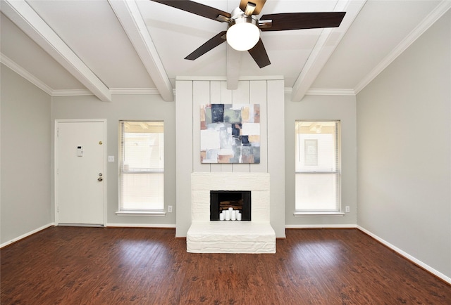 unfurnished living room featuring a stone fireplace, wood finished floors, beam ceiling, and a healthy amount of sunlight