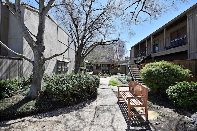 view of community featuring stairs