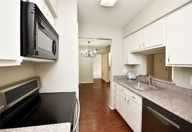 kitchen with dark wood finished floors, stainless steel appliances, light countertops, white cabinets, and a sink